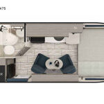 Comfortable Interior of Lance Travel Trailer 1475 featuring Queen Bed and Swivel Chairs