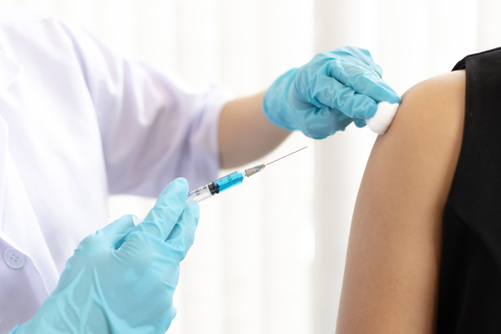 Woman getting travel vaccinations