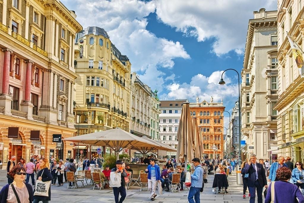 People enjoying a sunny day in Vienna, Austria, representing the sustainability approaches program.