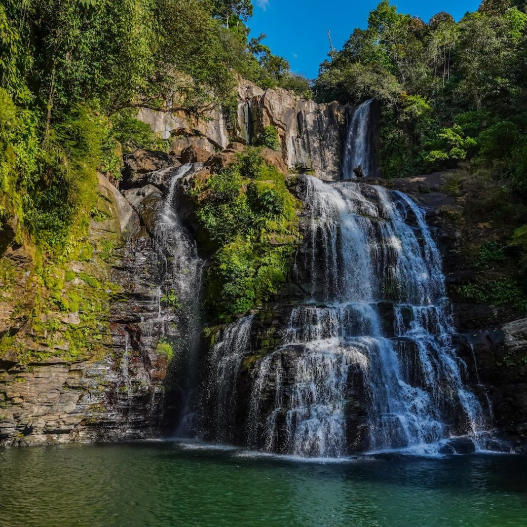 Image from Travel Awaits newsletter, showcasing a scenic waterfall in Costa Rica