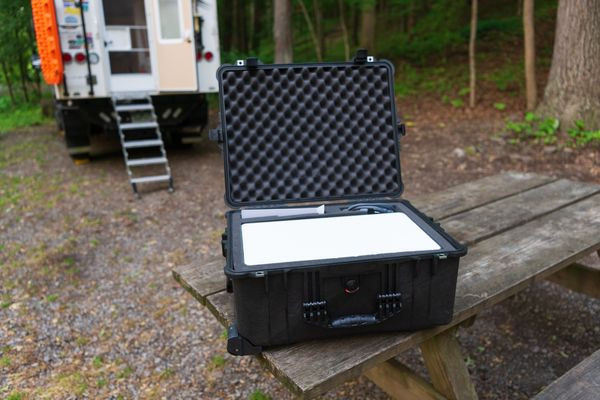 Using the custom Starlink Pelican case during an overland trip, highlighting its convenience and protection for on-the-go internet access.
