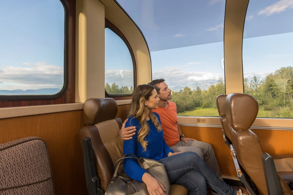 Couple inside a glass-domed train in Alaska