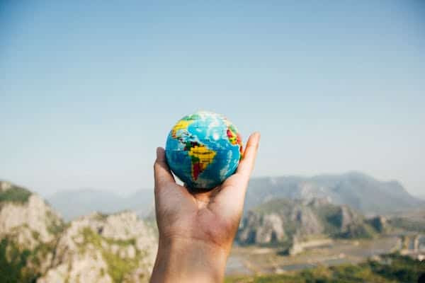 Someone holding a globe