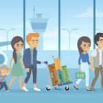 Family walking on beach, travel agents book flights