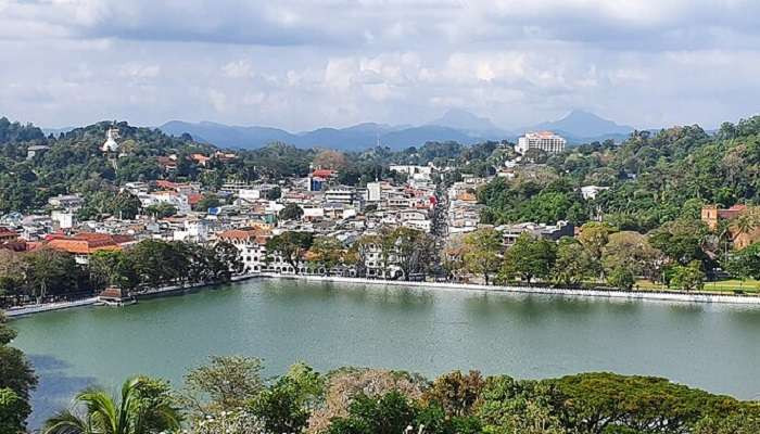 Kandy, Sri Lanka, showcasing its lush landscapes and historical sites. Perfect for hiking and wildlife safaris in Asia in August.