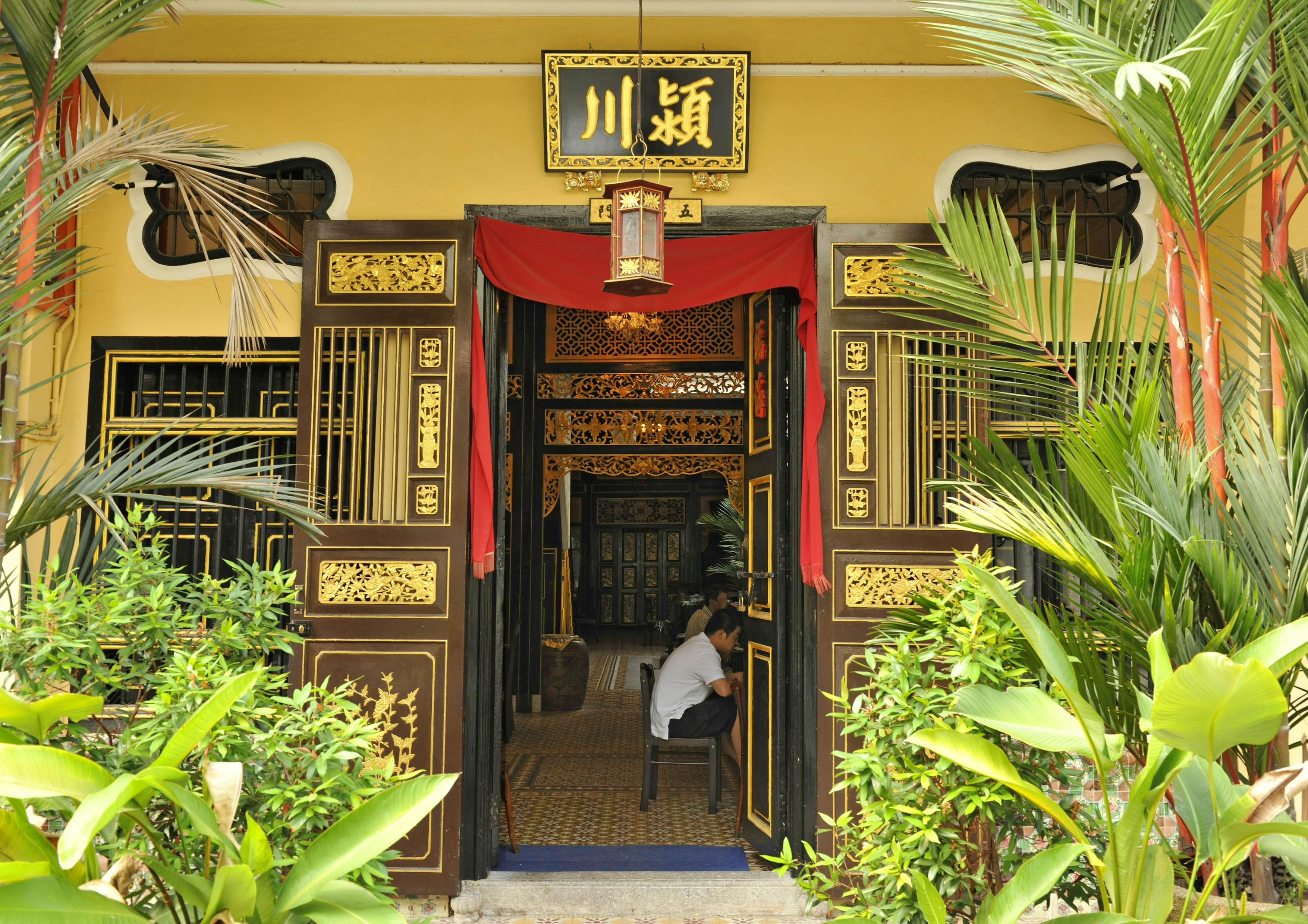 A doorway leading to a coffee shop in Penang, Malaysia